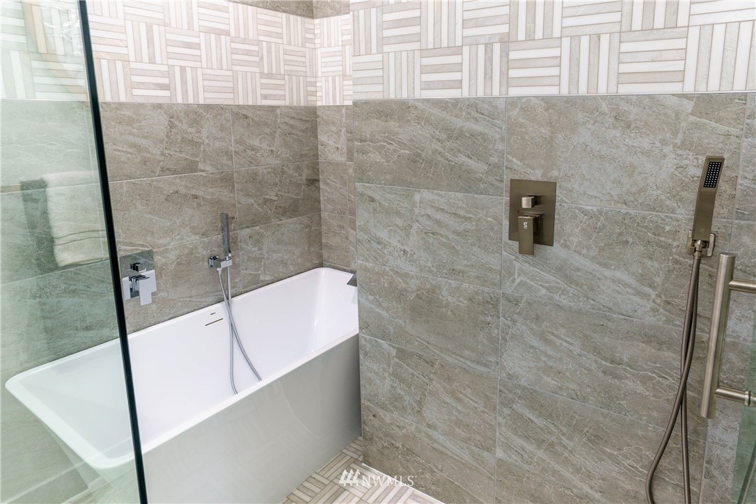1129 North 84th Street Seattle, WA 98103 - Photo 13 of 24 a bathroom with a bathtub