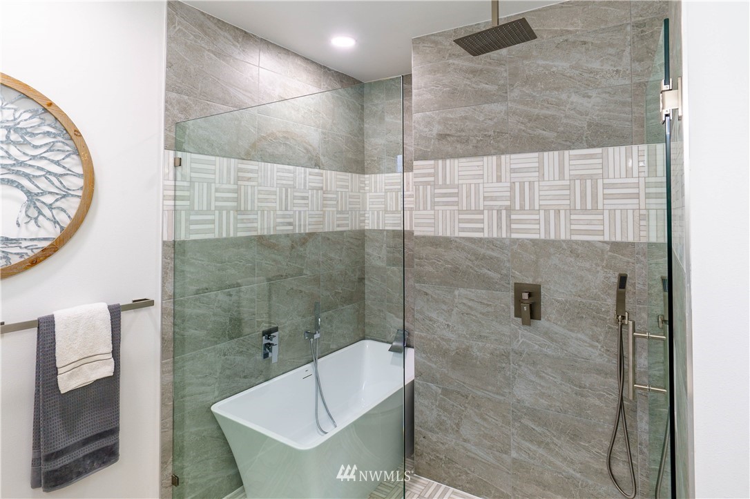 1129 North 84th Street Seattle, WA 98103 - Photo 14 of 24 a bathroom with a shower and a toilet