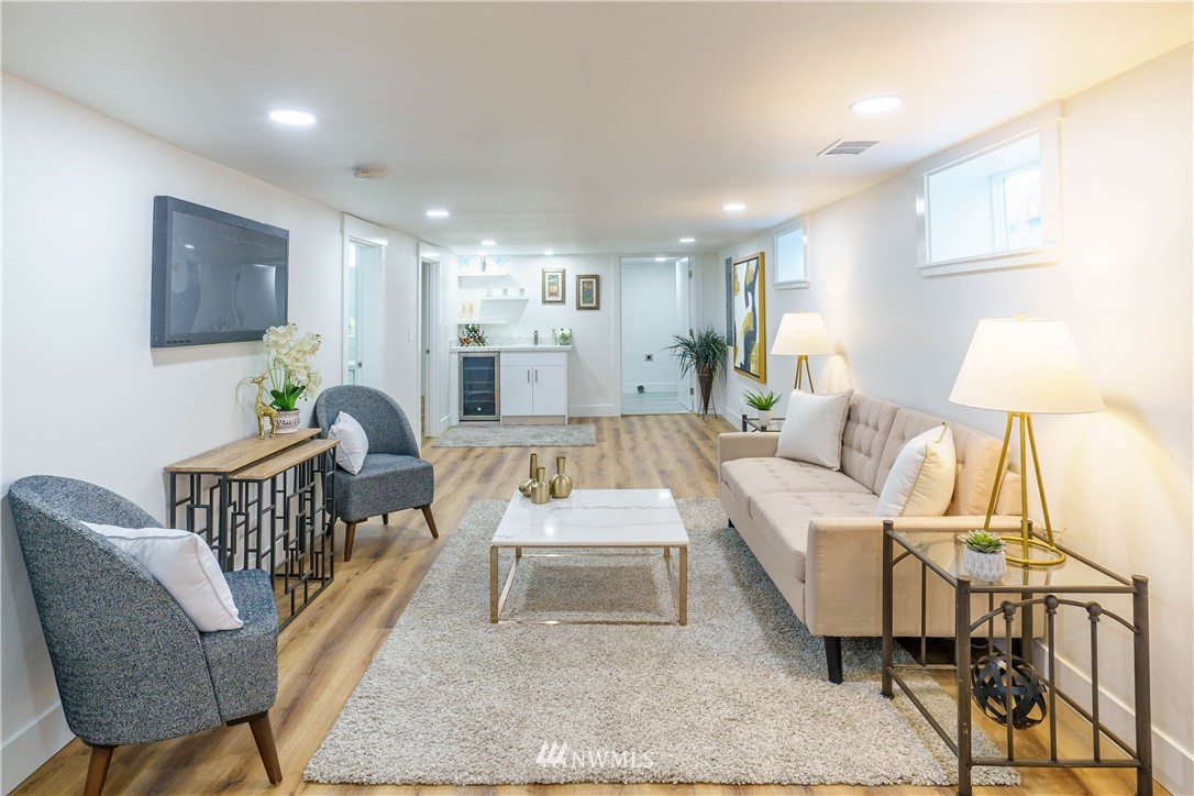 1129 North 84th Street Seattle, WA 98103 - Photo 16 of 24 a living room with furniture and a flat screen tv