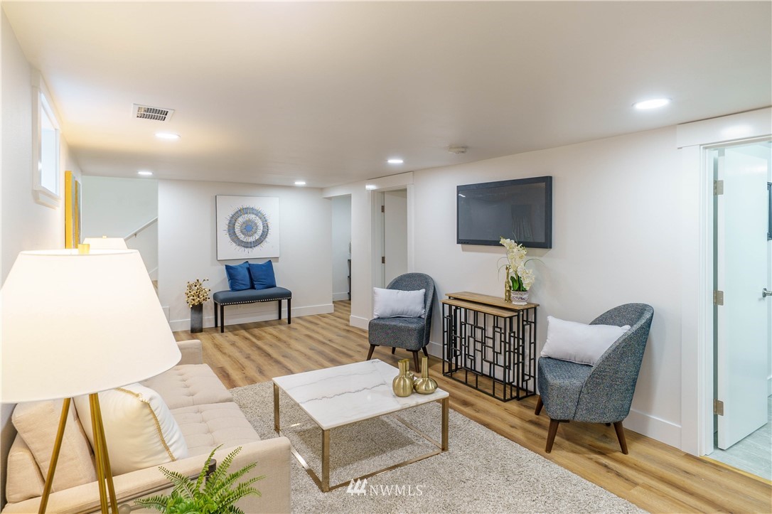 1129 North 84th Street Seattle, WA 98103 - Photo 17 of 24 a living room with furniture and a flat screen tv