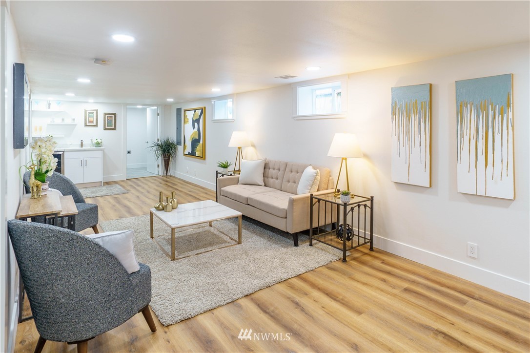 1129 North 84th Street Seattle, WA 98103 - Photo 18 of 24 a living room with furniture and a wooden floor