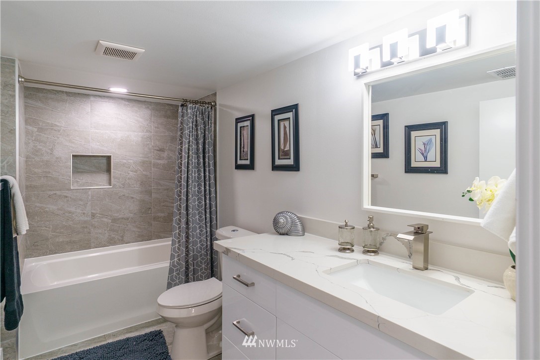 1129 North 84th Street Seattle, WA 98103 - Photo 20 of 24 a bathroom with a sink toilet and bathtub