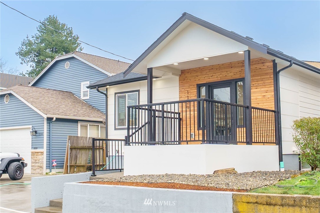 1129 North 84th Street Seattle, WA 98103 - Photo 24 of 24 a front view of a house with a yard