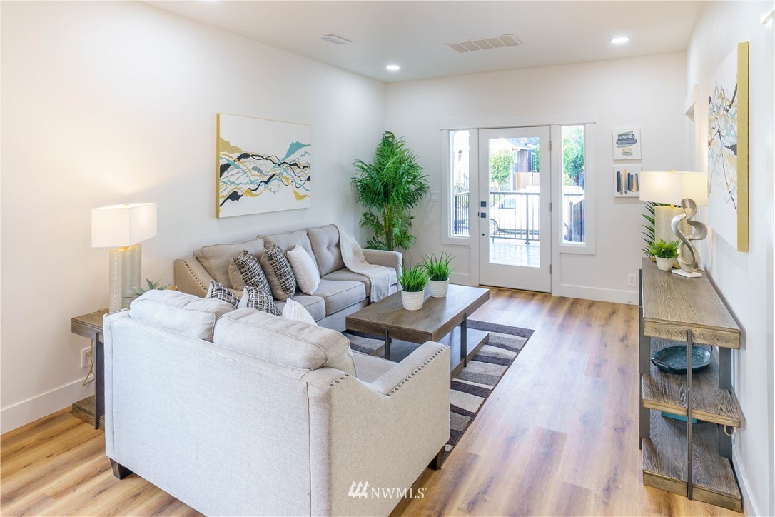 1129 North 84th Street Seattle, WA 98103 - Photo 3 of 24 a living room with furniture and a wooden floor