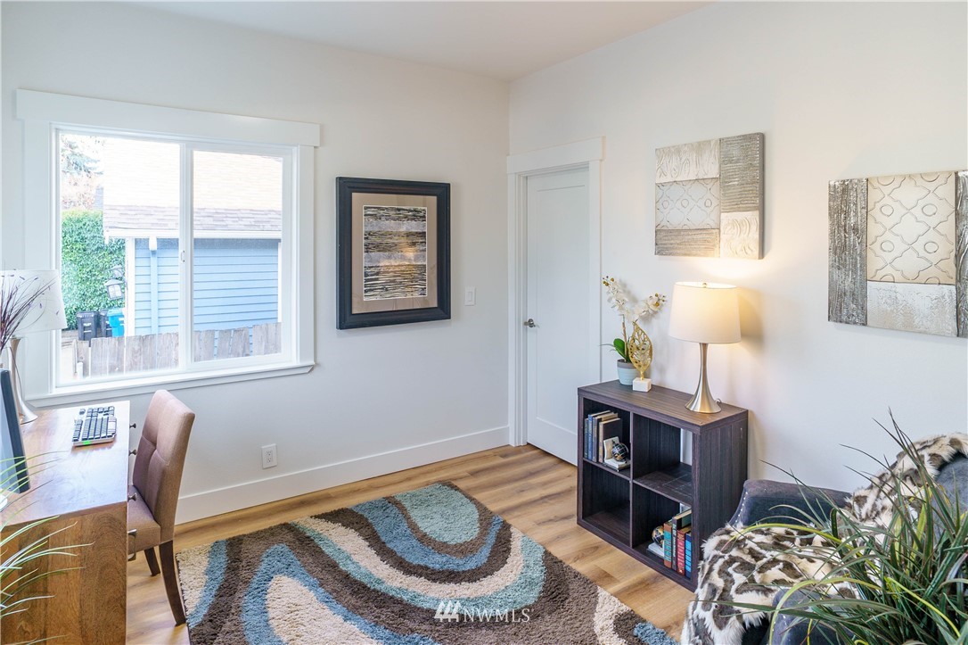 1129 North 84th Street Seattle, WA 98103 - Photo 4 of 24 a room with furniture and a window