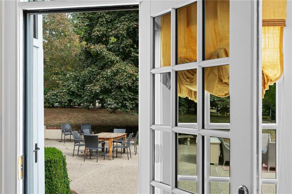 73 Stonedale Road Sewickley, PA 15143 - Photo 11 of 50 a view of a chair and table in a balcony