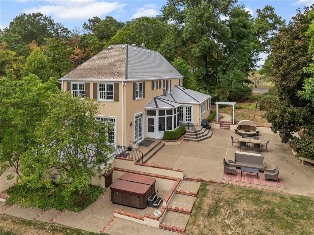 73 Stonedale Road Sewickley, PA 15143 - Photo 42 of 50 a white house with a small yard and large trees