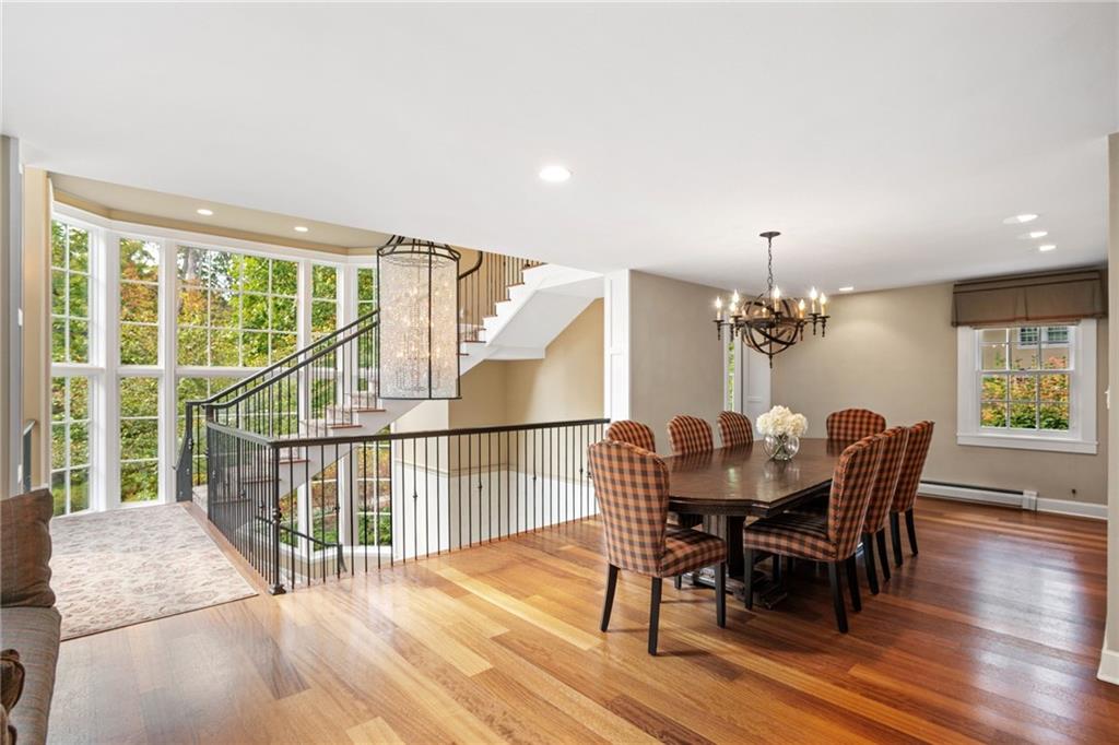 73 Stonedale Road Sewickley, PA 15143 - Photo 8 of 50 a dining room with furniture a chandelier and wooden floor
