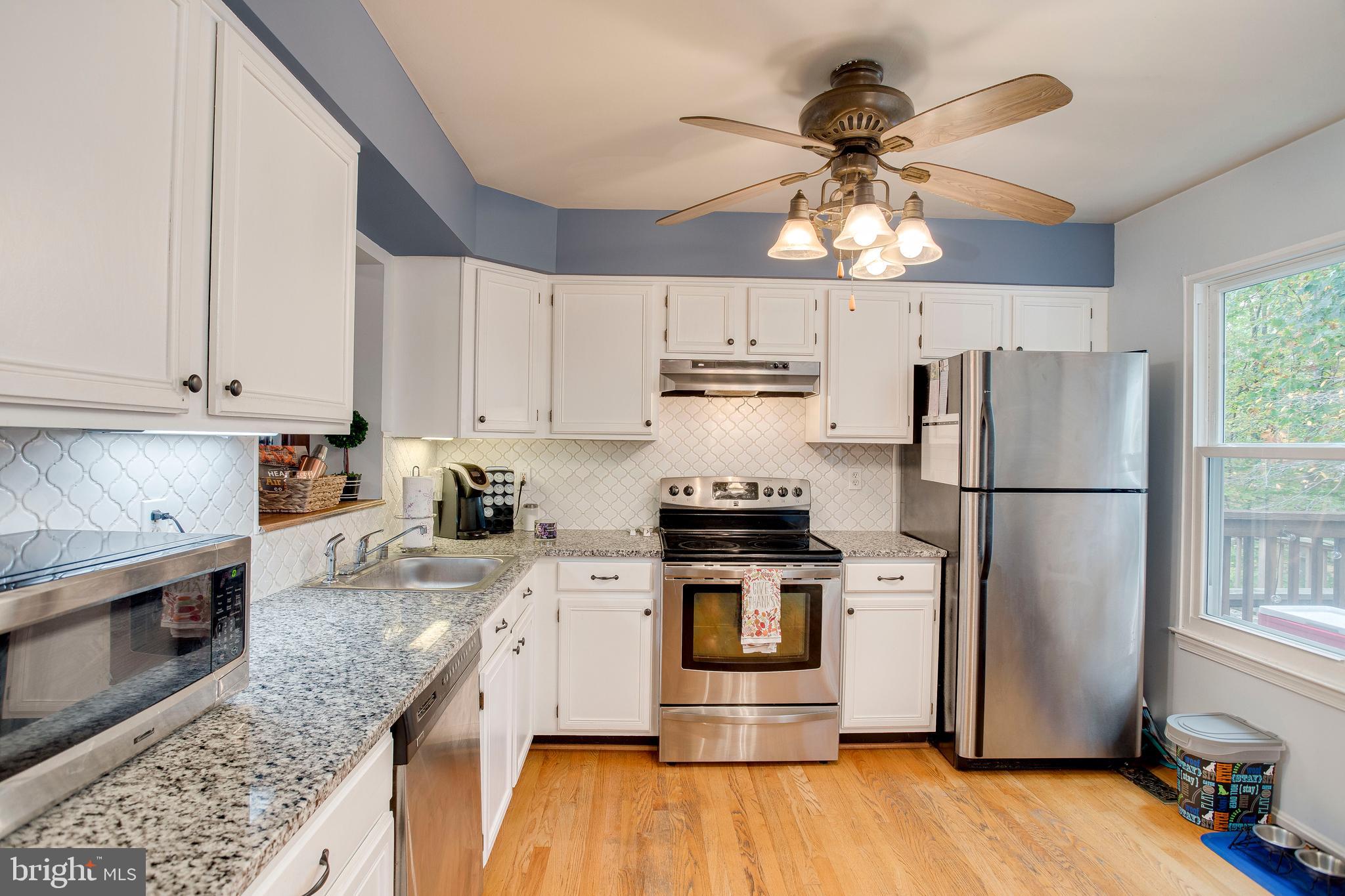 1123 Ingate Road Baltimore, MD 21227 - Photo 12 of 28 NEW white back splash + New sink & granite