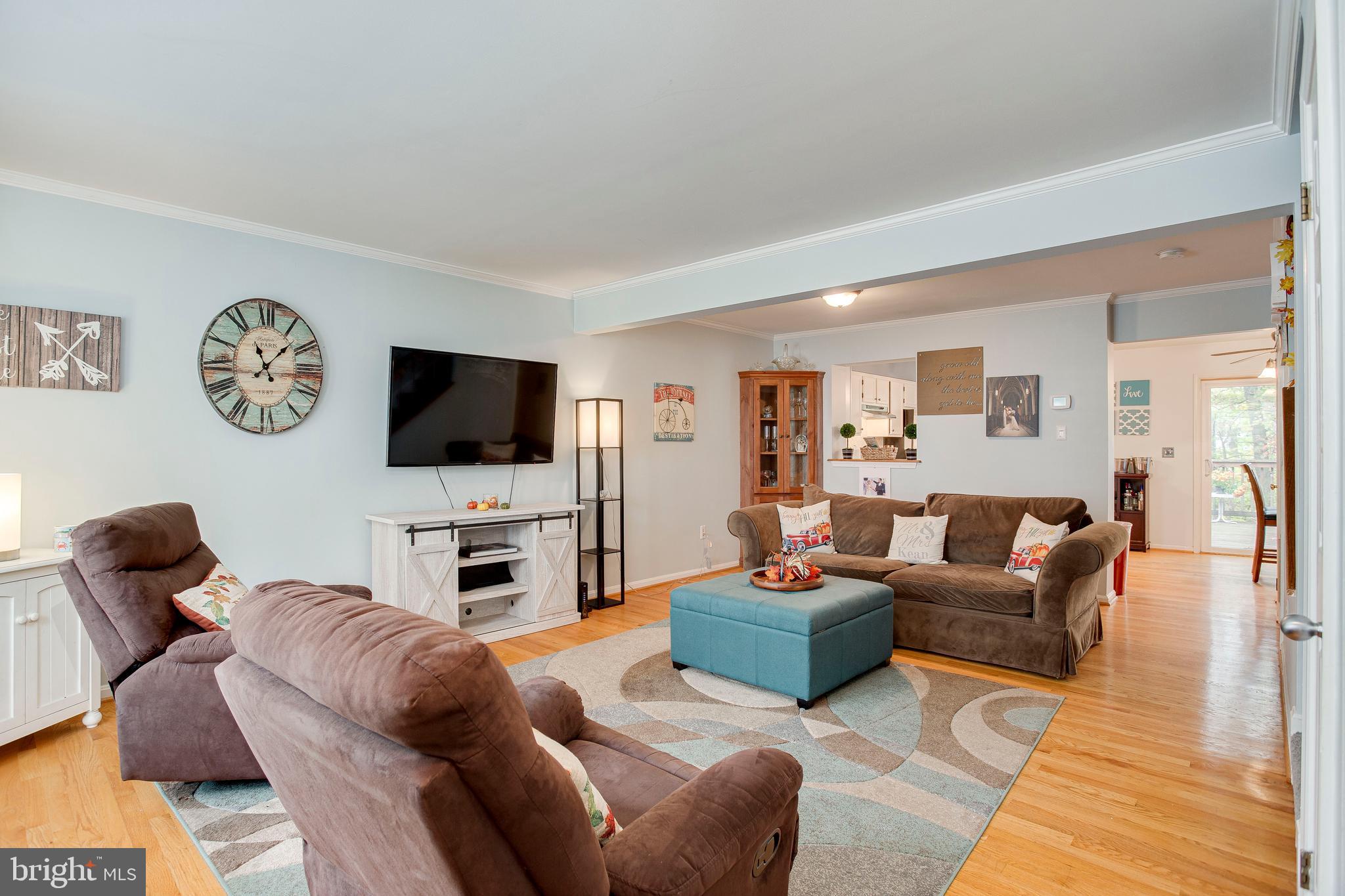 1123 Ingate Road Baltimore, MD 21227 - Photo 5 of 28 Warm & inviting LR/DR combo with exposed HW floors
