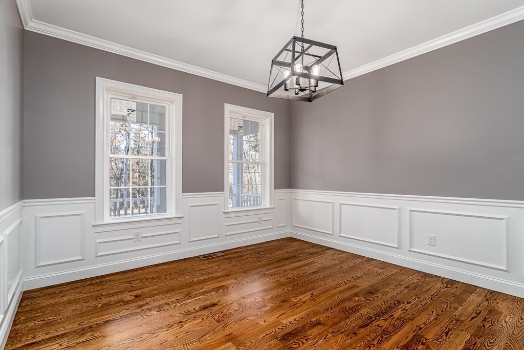 117 Center Road Shirley, MA 01464 - Photo 16 of 42 a view of empty room with wooden floor and fan