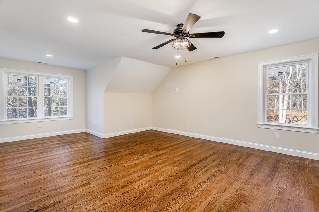 117 Center Road Shirley, MA 01464 - Photo 18 of 42 a view of an empty room with a window and wooden floor