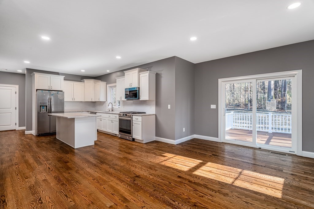 117 Center Road Shirley, MA 01464 - Photo 8 of 42 a open kitchen with white cabinets and refrigerator