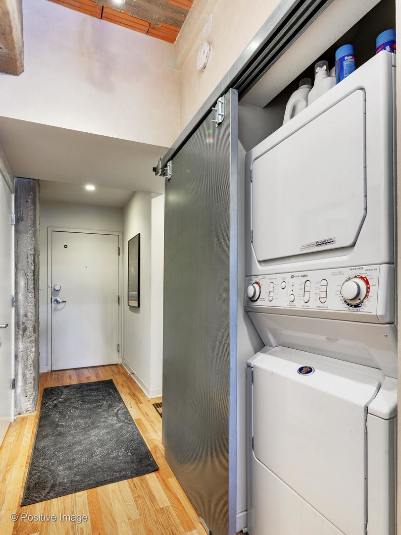Undisclosed Address Chicago, IL 60616 - Photo 17 of 18 a view of a storage & utility room with washer and dryer