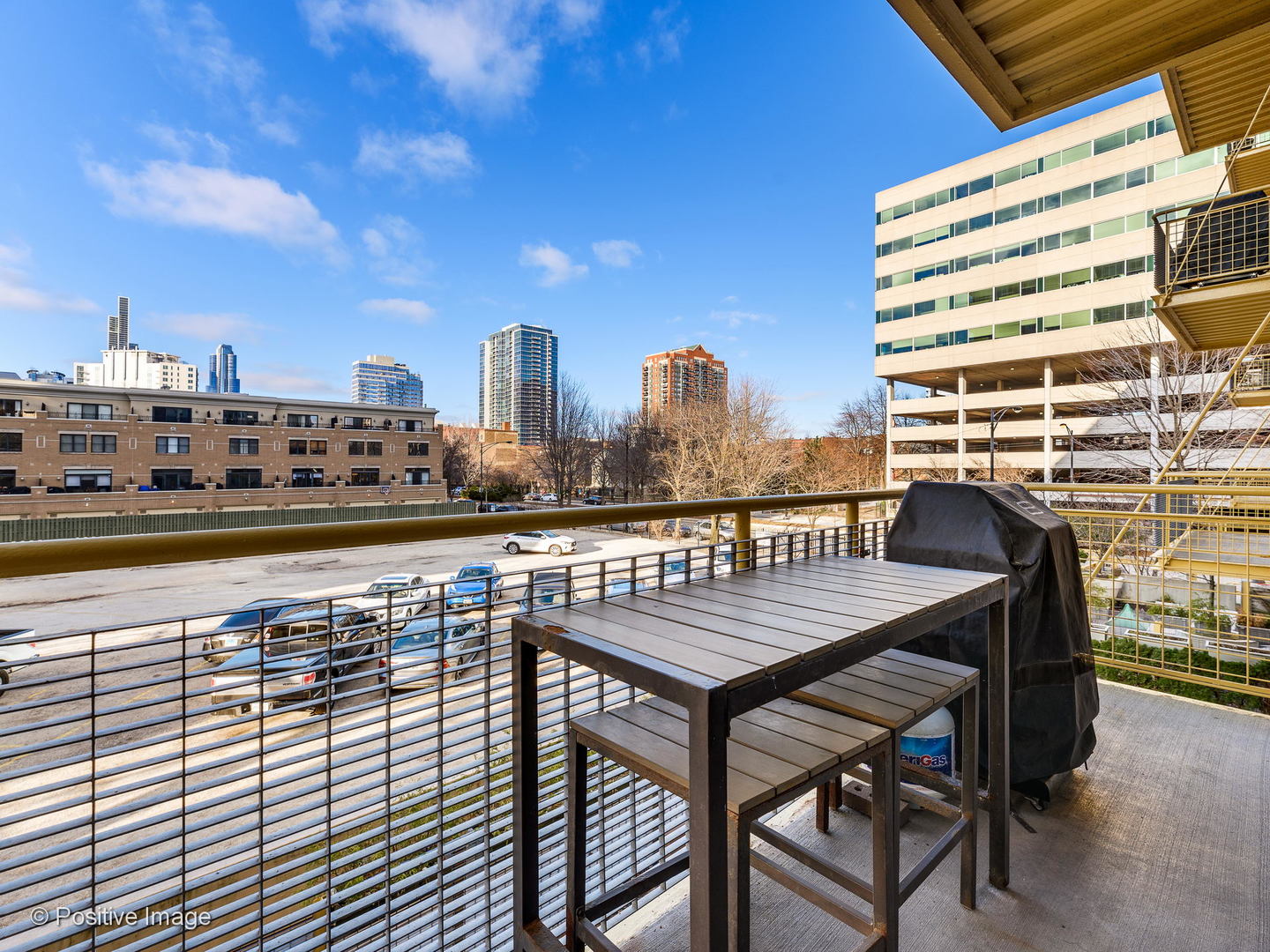Undisclosed Address Chicago, IL 60616 - Photo 18 of 18 a roof deck with a table and chairs