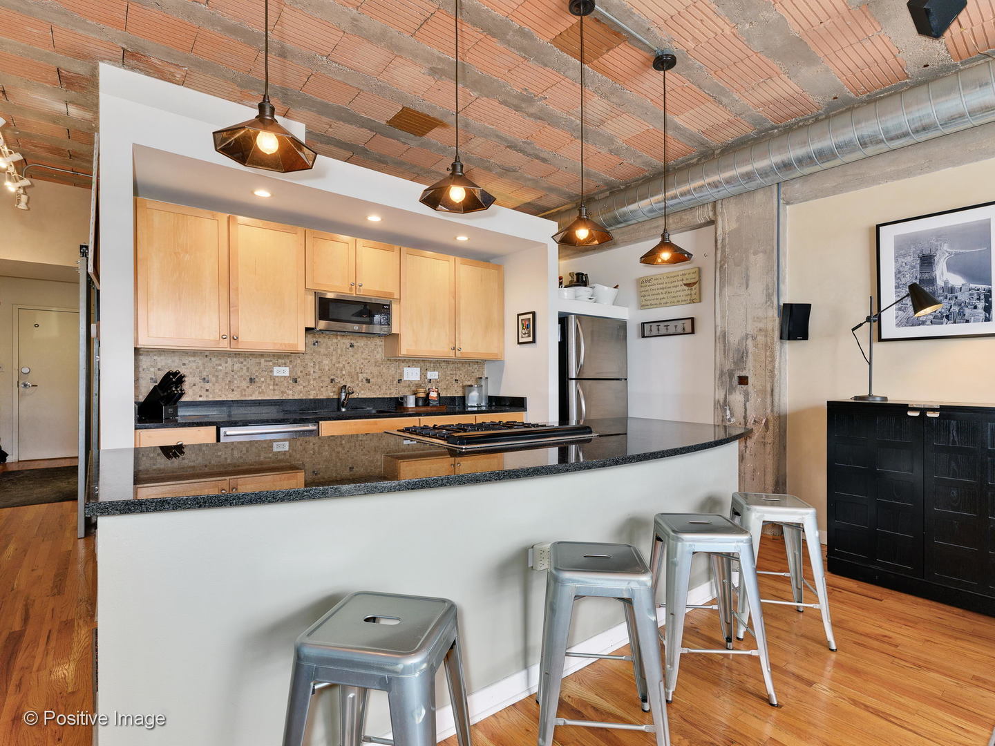 Undisclosed Address Chicago, IL 60616 - Photo 4 of 18 a large kitchen with a table and chairs