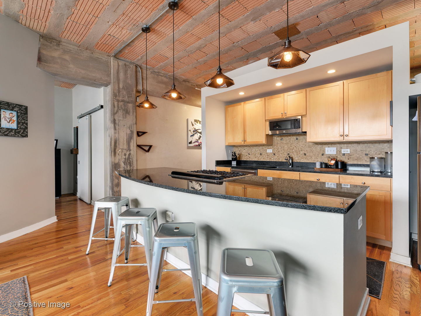 Undisclosed Address Chicago, IL 60616 - Photo 5 of 18 a kitchen with stainless steel appliances granite countertop a sink a stove and chairs