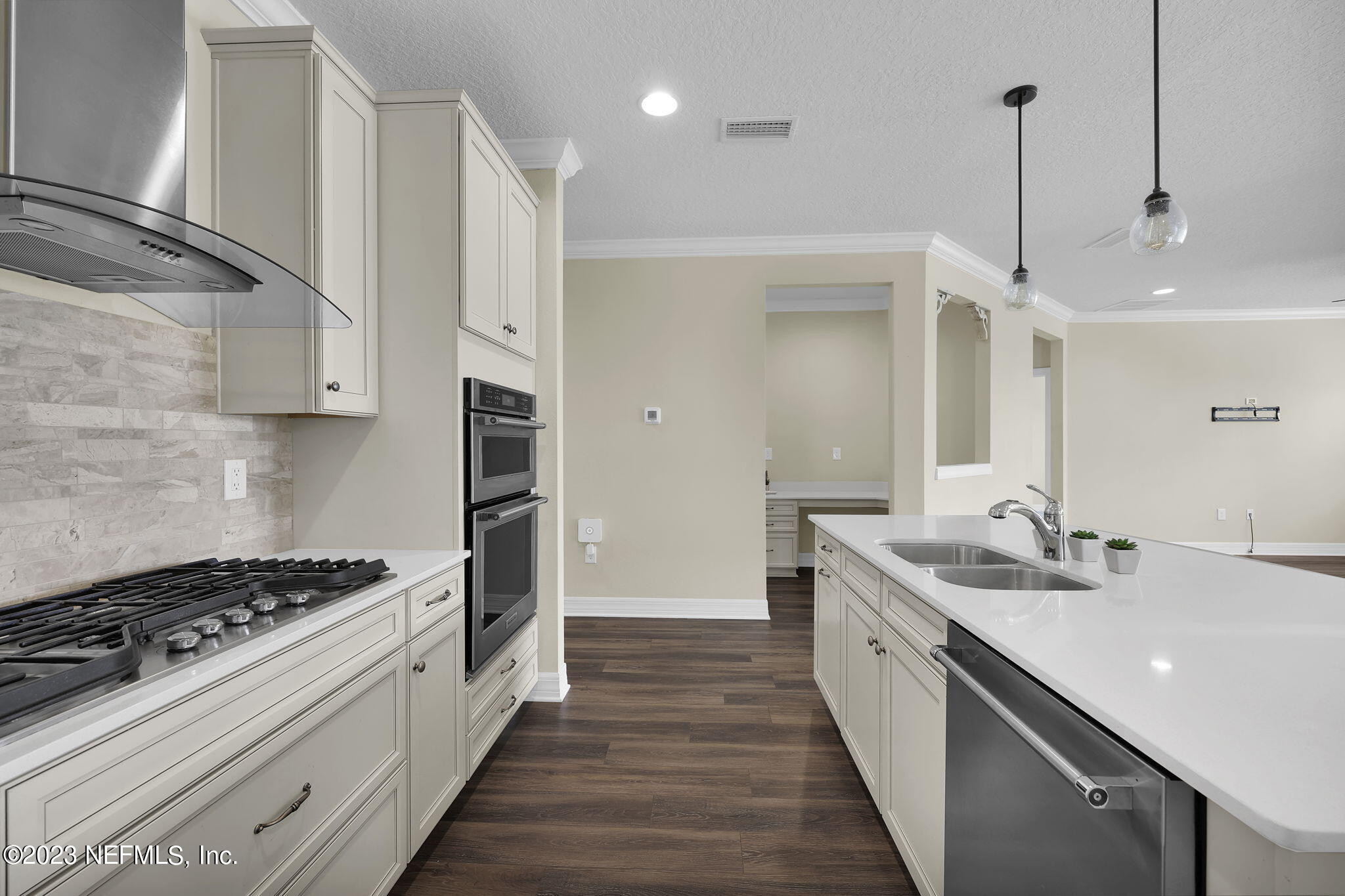 39 Lakefront Lane St. Augustine, FL 32095 - Photo 16 of 66 a kitchen with a sink stove and cabinets