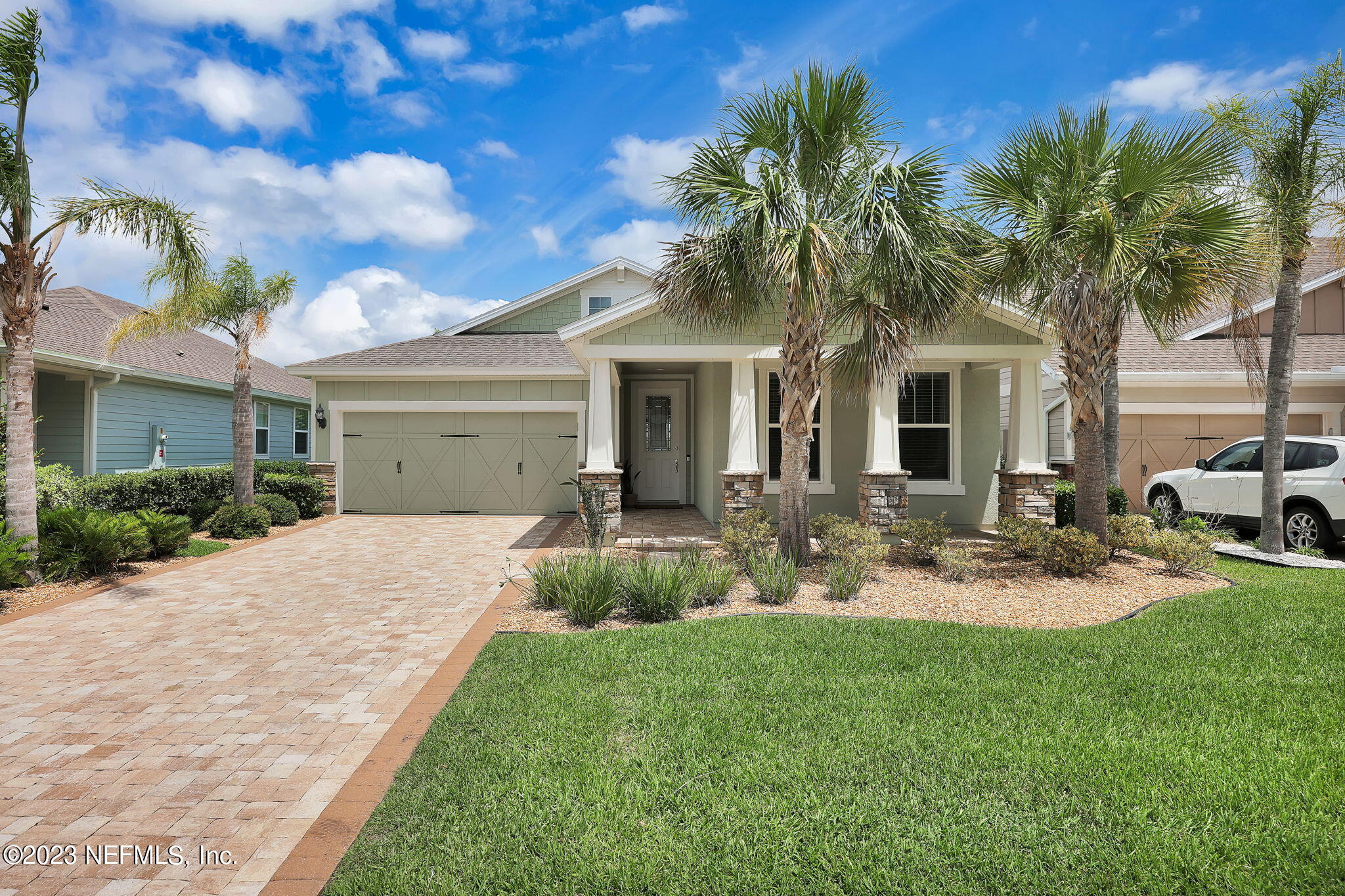 39 Lakefront Lane St. Augustine, FL 32095 - Photo 65 of 66 a front view of a house with garden and patio