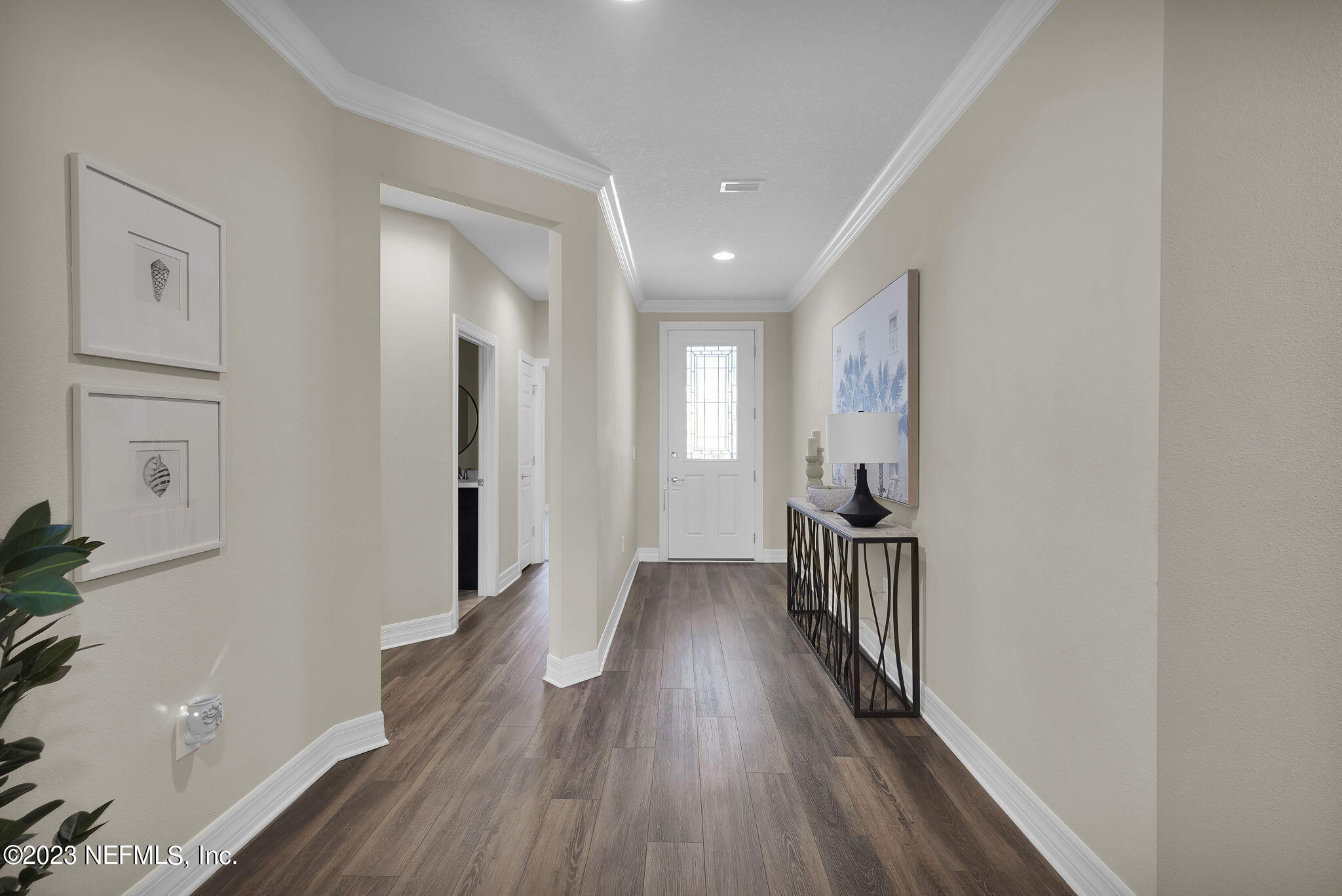 39 Lakefront Lane St. Augustine, FL 32095 - Photo 9 of 66 a view of a hallway with wooden floor and a bathroom