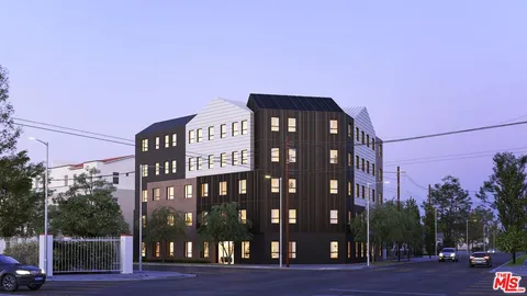 a front view of a building with garden