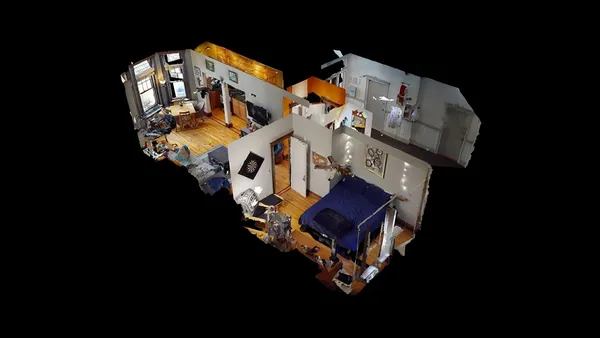 an aerial view of a house with backyard