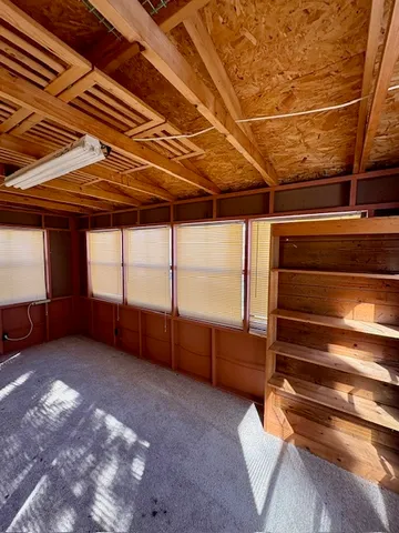 a view of an empty room with a balcony
