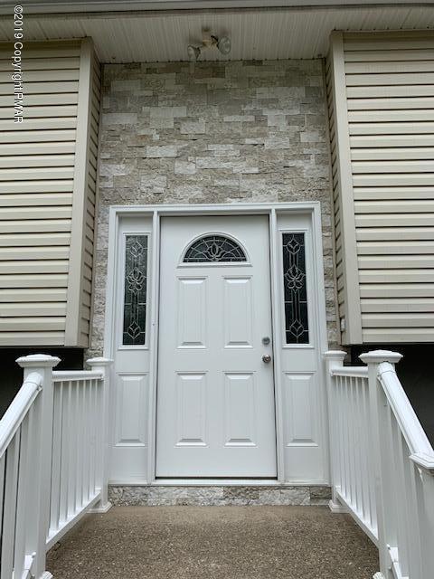1023 Dancing Ridge Road East Stroudsburg, PA 18302 - Photo 3 of 23 a view of front door of house