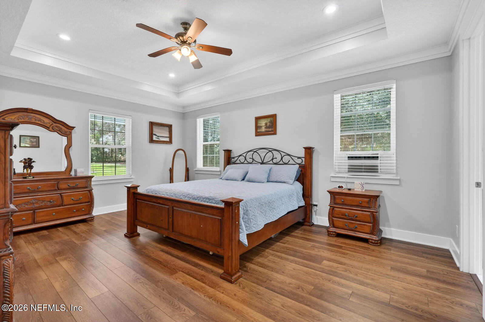 264 Peniel Church Road Palatka, FL 32177 - Photo 18 of 48 a bedroom with a bed and a dresser with wooden floor