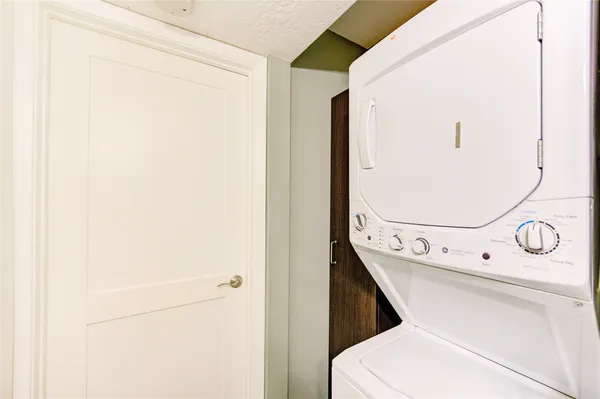 a bathroom with a toilet and a mirror
