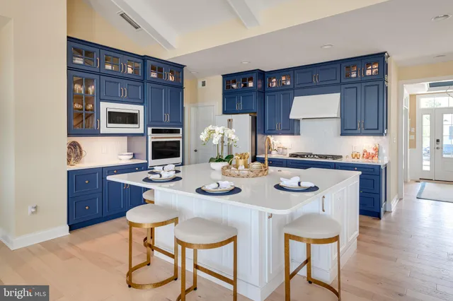 a kitchen with a dining table and chairs