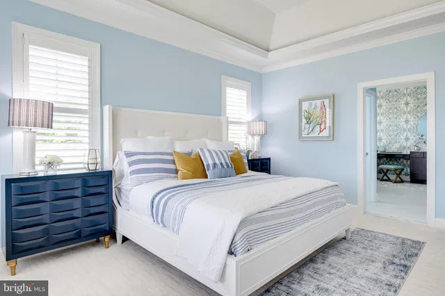 a bed room with a bed and a window