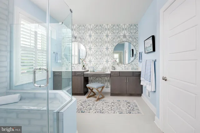 a bathroom with a tub sink and mirror