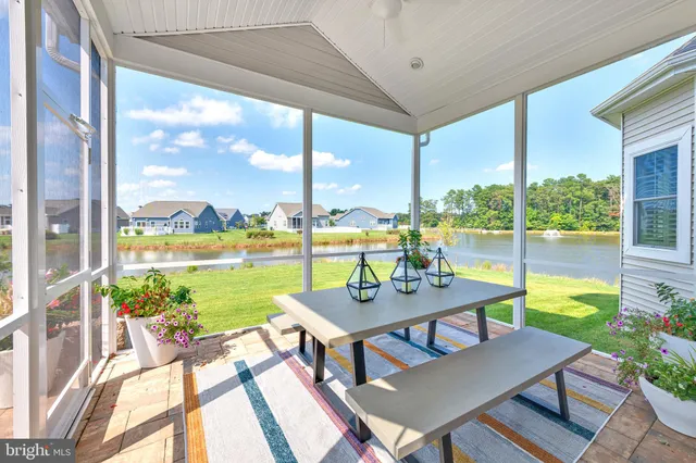 a view of a porch with furniture and garden