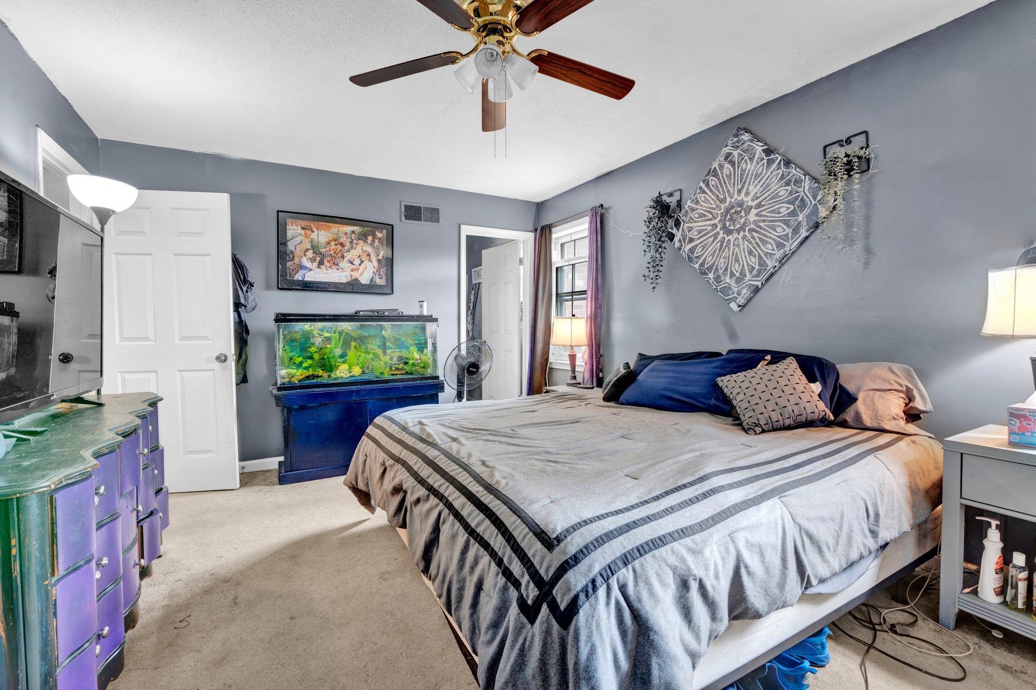 3086 Altruria Road Bartlett, TN 38134 - Photo 11 of 21 a bedroom with a bed and a flat screen tv