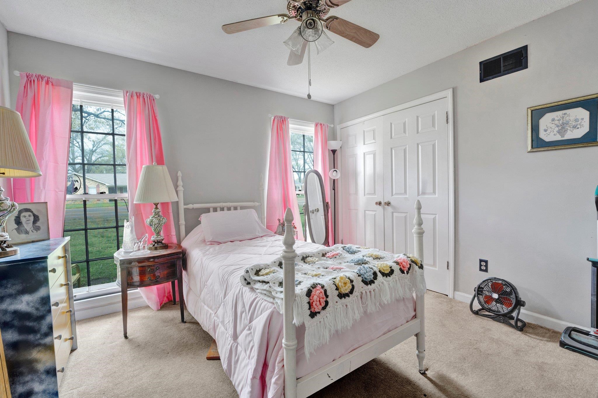 3086 Altruria Road Bartlett, TN 38134 - Photo 12 of 21 a bedroom with a bed and a chandelier