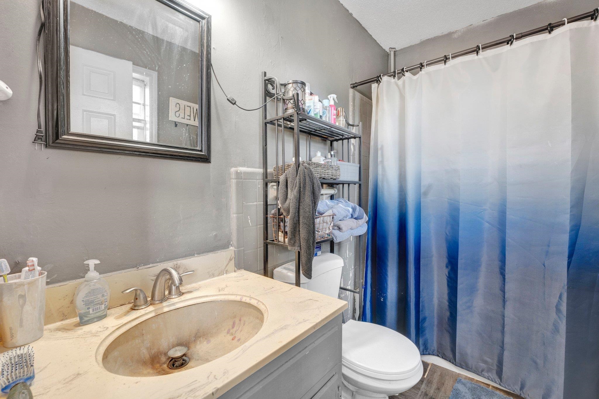 3086 Altruria Road Bartlett, TN 38134 - Photo 13 of 21 a bathroom with a sink toilet and shower
