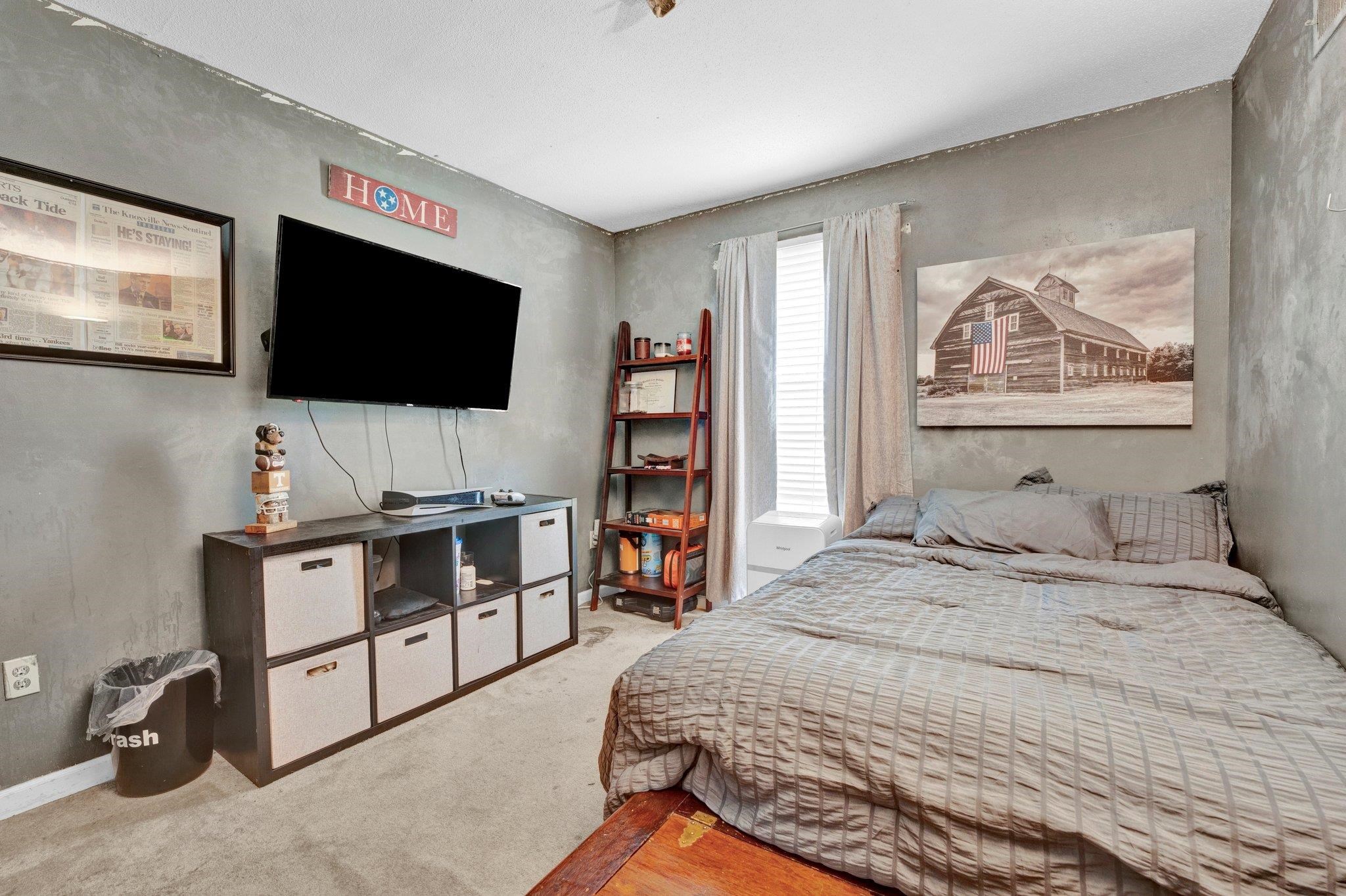 3086 Altruria Road Bartlett, TN 38134 - Photo 14 of 21 a bedroom with a bed and a flat screen tv