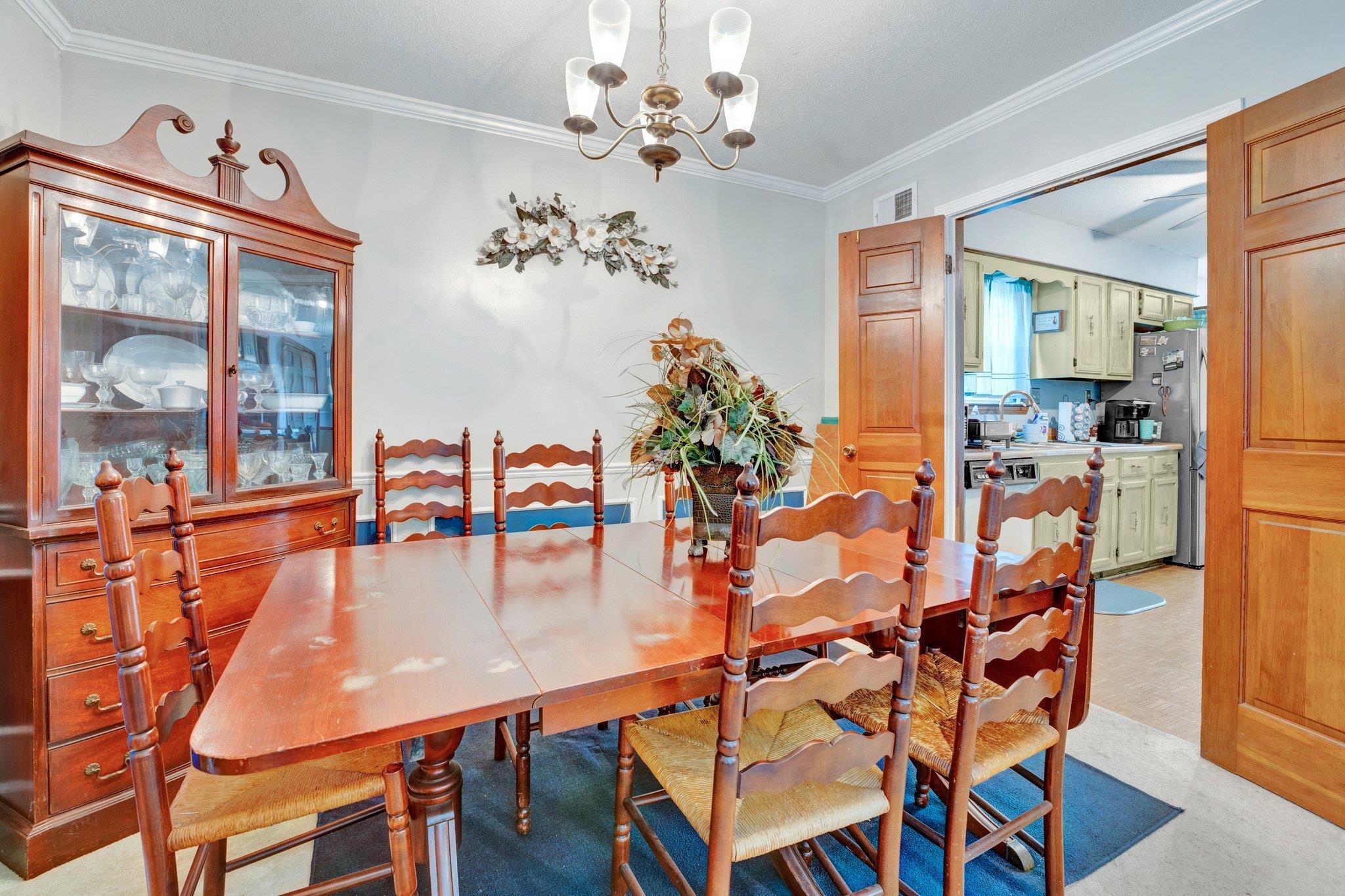 3086 Altruria Road Bartlett, TN 38134 - Photo 5 of 21 a dining room with furniture a chandelier and wooden floor