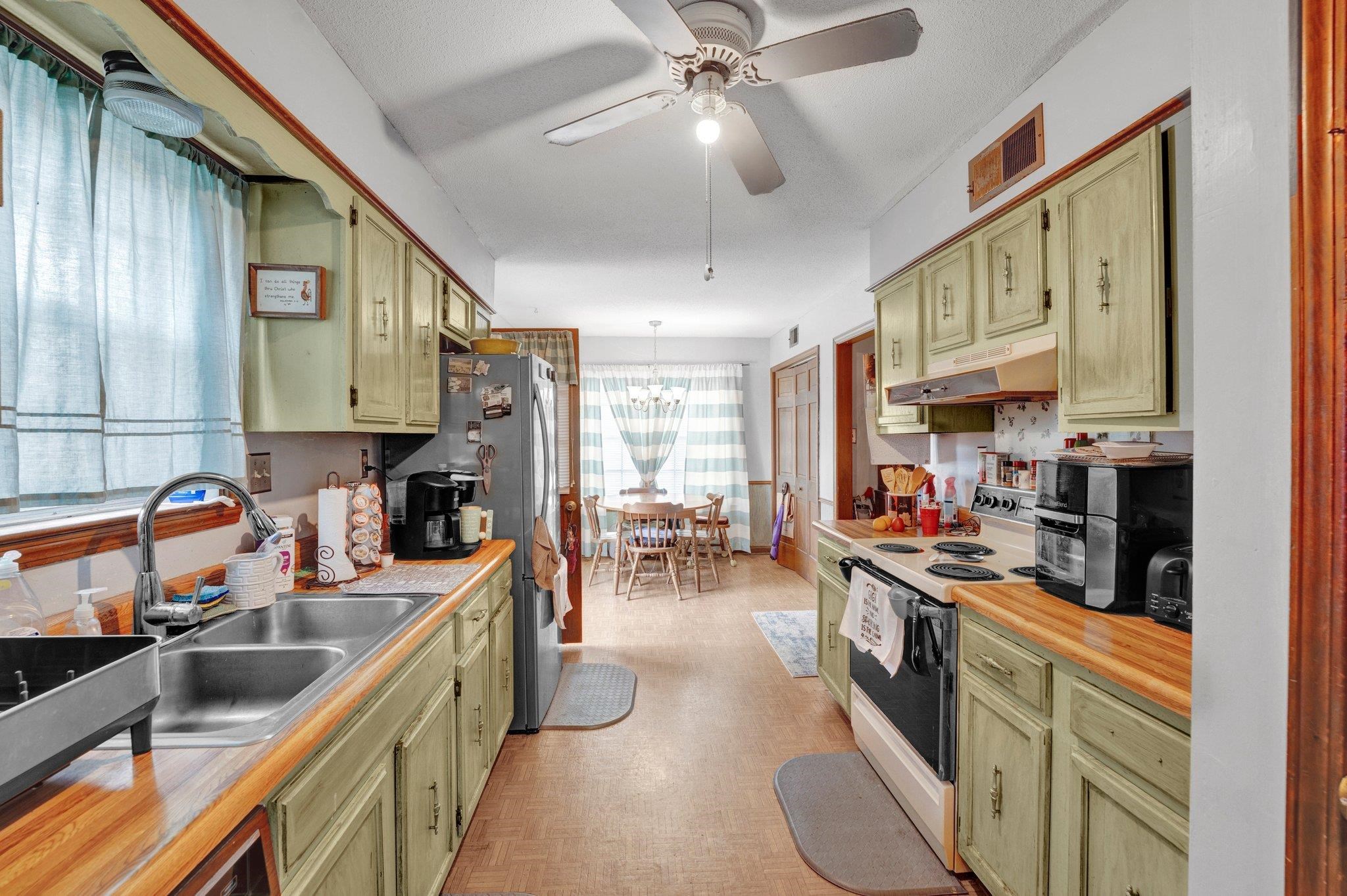 3086 Altruria Road Bartlett, TN 38134 - Photo 7 of 21 a kitchen filled with stainless steel appliances kitchen island granite countertop a sink stove and cabinets