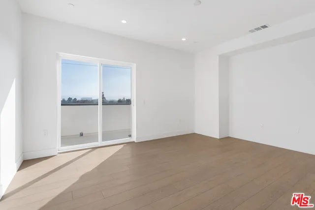 a view of a livingroom with furniture and a table
