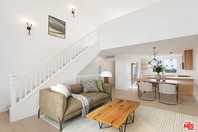 a view of a room with stairs and a living room