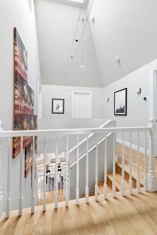 58 Liberty Avenue, Unit 2 Somerville, MA 02144 - Photo 12 of 22 a view of a hallway with wooden floor and windows