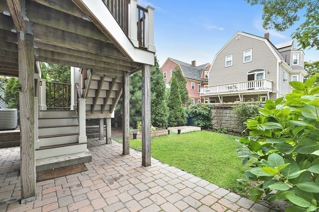 58 Liberty Avenue, Unit 2 Somerville, MA 02144 - Photo 19 of 22 a front view of a house with a yard
