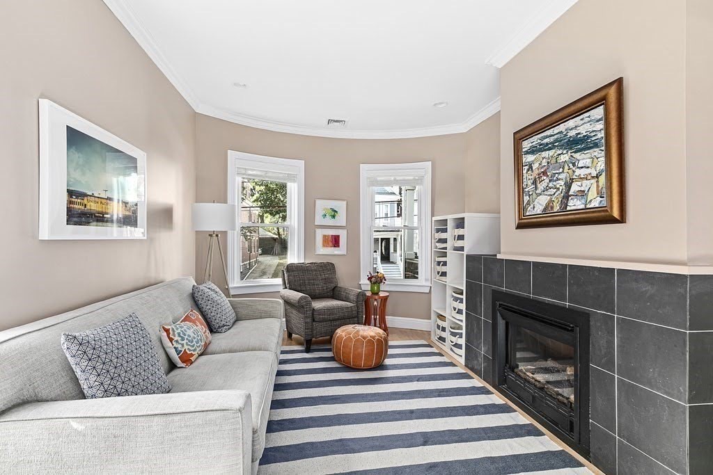 58 Liberty Avenue, Unit 2 Somerville, MA 02144 - Photo 2 of 22 a living room with furniture a fireplace and a window