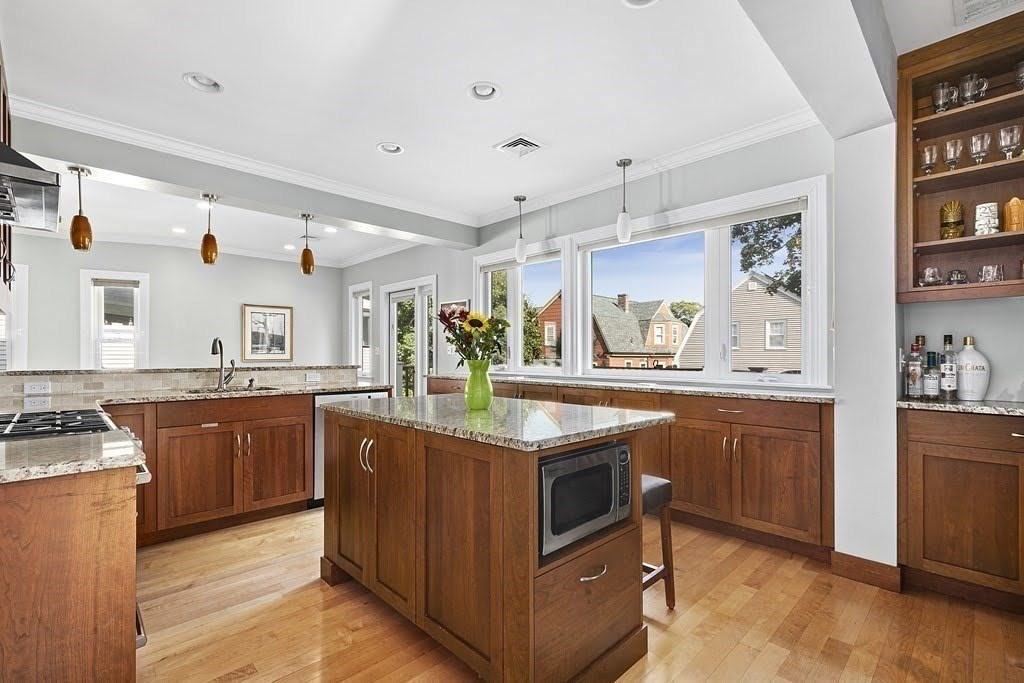 58 Liberty Avenue, Unit 2 Somerville, MA 02144 - Photo 4 of 22 a kitchen with granite countertop cabinets stainless steel appliances and a counter space