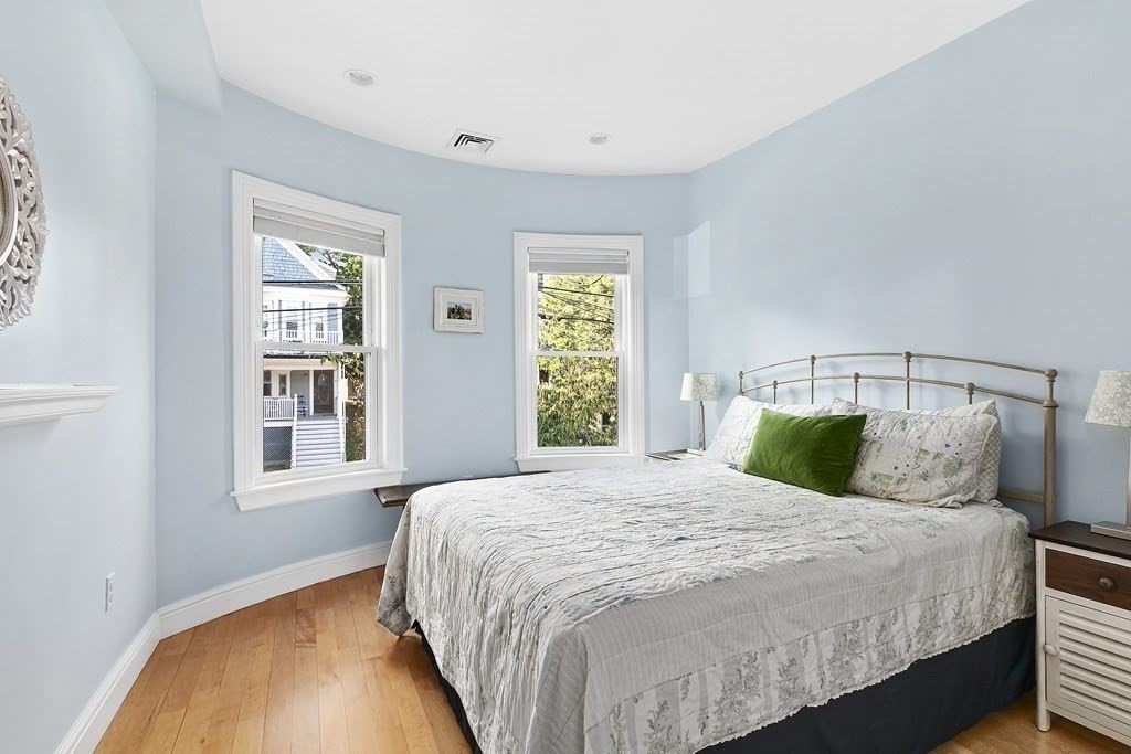 58 Liberty Avenue, Unit 2 Somerville, MA 02144 - Photo 8 of 22 a bedroom with a large bed and a window