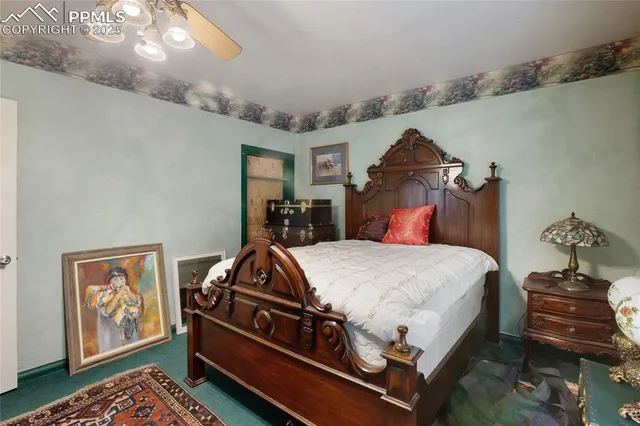 a bed sitting in a bedroom and dresser