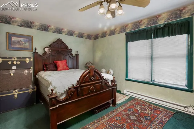 a bed room with a bed and a chandelier