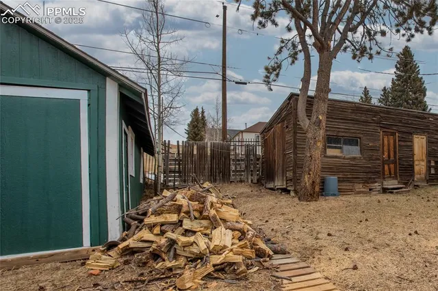 a view of a house with a snow in the yard